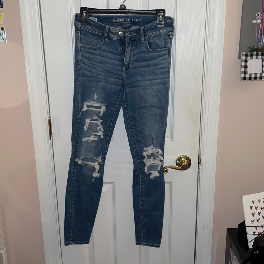 AMERICAN EAGLE NEXT LEVEL STRECH RIPPED SKINNY JEANS